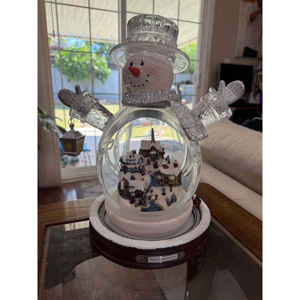 Bradford Thomas Kinkade Crystal Snowman with Light-Up Village and Animated Train